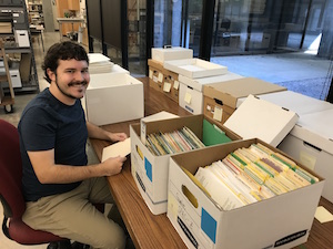 Jay Arms, 2017-2018 CART fellow, processing the organizational records of Other Minds