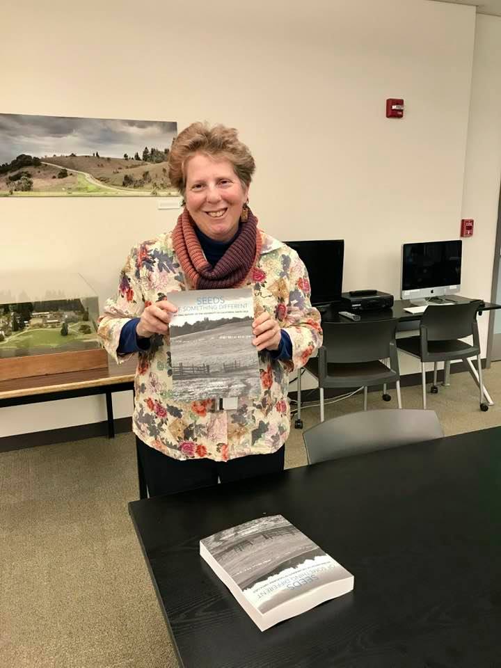 Irene Reti holding Seeds book