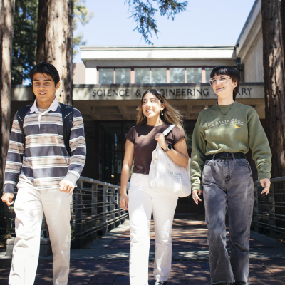 Photo of three students in front of the UCSC science and engineering library
