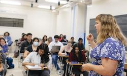 UCSC instructor with students in a classroom