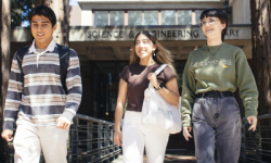 Photo of three students in front of the UCSC science and engineering library