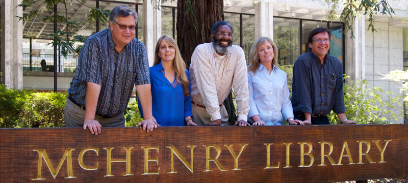 The Undergraduate Experience team in front of McHenry library sign